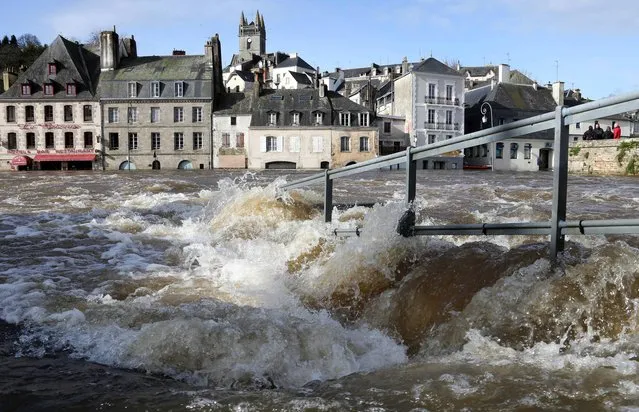The centre of Quimperle, western France, is flooded by the Laita river, Friday, February 7, 2014. Floods are washing over northwestern France due to  heavy rains. (Photo by David Vincent/AP Photo)