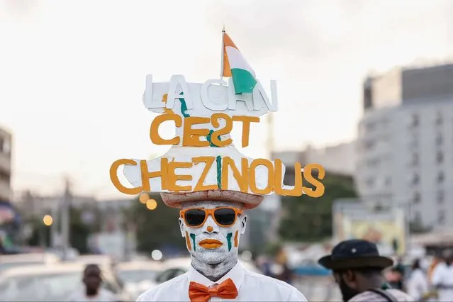 A fan sports a hat celebrating Ivory Coast's victory at the Africa Cup of Nations 2024, during the parade in Abidjan, on February 12, 2024. (Photo by Daniel Beloumou Olomo/AFP Photo)