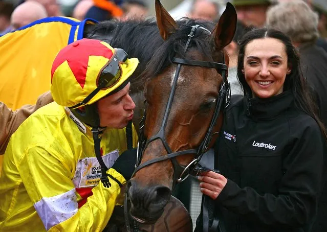 Jockey Harry Skelton kisses Protektorat after winning the Ryanair Chase race on the third day of the Cheltenham Festival at Cheltenham Racecourse, in Cheltenham, western England on March 14, 2024. (Photo by Ben Stansall/AFP Photo)