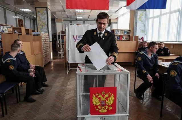 Burov Denis, rector of the Maritime State University named after admiral Gennady Nevelskoy, votes in the presidential election in the far eastern city of Vladivostok, Russia, on March 15, 2024. (Photo by Tatiana Meel/Reuters)