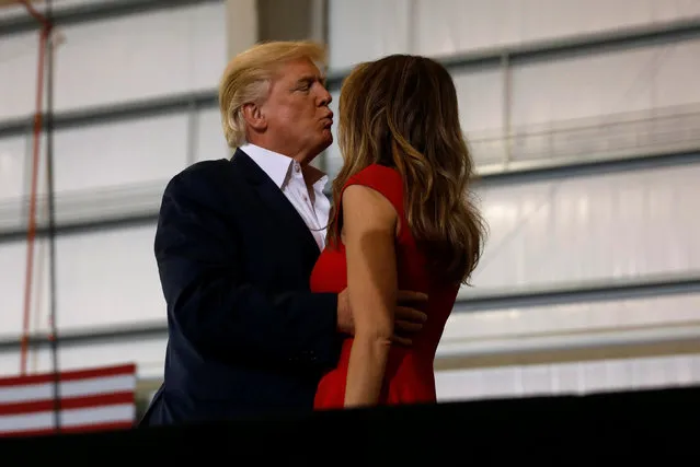 U.S. President Donald Trump kisses his wife Melania during a “Make America Great Again” rally at Orlando Melbourne International Airport in Melbourne, Florida, U.S. February 18, 2017. (Photo by Kevin Lamarque/Reuters)