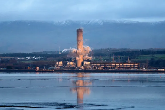 The 600 foot high chimney stack at Longannet Power Station in Fife, Scotland is brought down by controlled explosion on Thursday, December 9, 2021. (Photo by Jane Barlow/PA Images via Getty Images)