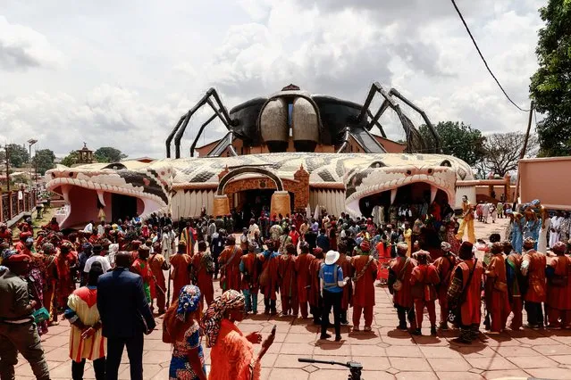 People attend the inauguration ceremony of the new Bamoun Kings Museum in Foumban, on April 13, 2024. Cameroon is home to 270 ethnic groups with different customs and languages, and officially, more than 80 first-degree chiefdoms dating from the precolonial era. The kingdom of the Bamouns, founded in 1384, is today one of the oldest in sub-Saharan Africa. The new Bamoun Kings Museum, inaugurated on April 13, 2024, was built reproducing the coat of arms of the kingdom over 5,000 square meters and three floors, and houses nearly 12,500 items reflecting the richness, variety, and craftsmanship of the Bamoun artisans. (Photo by Daniel Beloumou Olomo/AFP Photo)