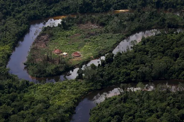 A village of indigenous Yanomami is seen during Brazil’s environmental agency operation against illegal gold mining on indigenous land, in the heart of the Amazon rainforest, in Roraima state, Brazil April 18, 2016. (Photo by Bruno Kelly/Reuters)