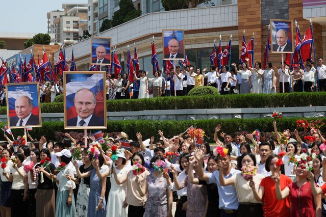 People greet the motorcade of Russia's President Vladimir Putin in Pyongyang, North Korea on June 19, 2024. (Photo by Gavriil Grigorov/Sputnik/Pool via Reuters)