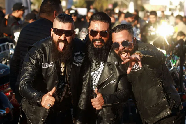 Libyan bikers pose for a picture during a festival organized by the Benghazi Motorcycles Club, in the eastern city of Benghazi, on March 15, 2022. (Photo by Abdullah Doma/AFP Photo)