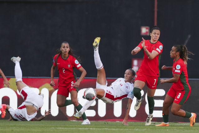 Portuguese players Catarina Amado (L) and Stephanie Ribeiro (R) fight for the ball with Malta player Emma Lipman (C) during their qualifying match for the UEFA Women's European Championship 2025 at Dr Magalhaes Pessoa Stadium, in Leiria, Portugal on July 16, 2024. (Photo by Paulo Cunha/LUSA)