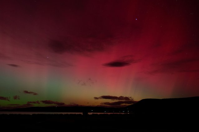 A view shows the lights of an aurora australis caused by a geomagnetic storm, in Punta Carrera, Chile on May 10, 2024. (Photo by Joel Estay/Reuters)