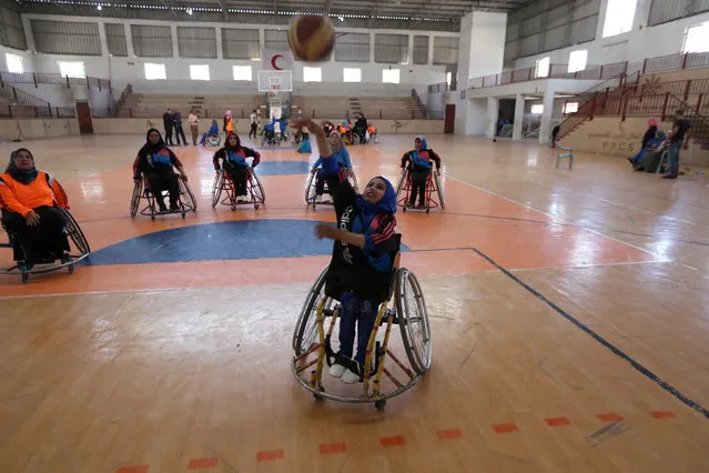 Jess Markt of the U.S. coaches disabled Palestinian women on wheelchair basketball during a training session organised by the International Committee of the Red Cross (ICRC) in Khan Younis in the southern Gaza Strip May 28, 2016. (Photo by Ibraheem Abu Mustafa/Reuters)