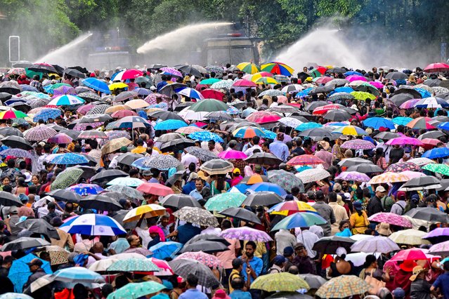 Police use water cannons and tear gas to disperse teachers and principals protesting against salary anomalies during an anti-government demonstration in Colombo on June 26, 2024. (Photo by Ishara S. Kodikara/AFP Photo)