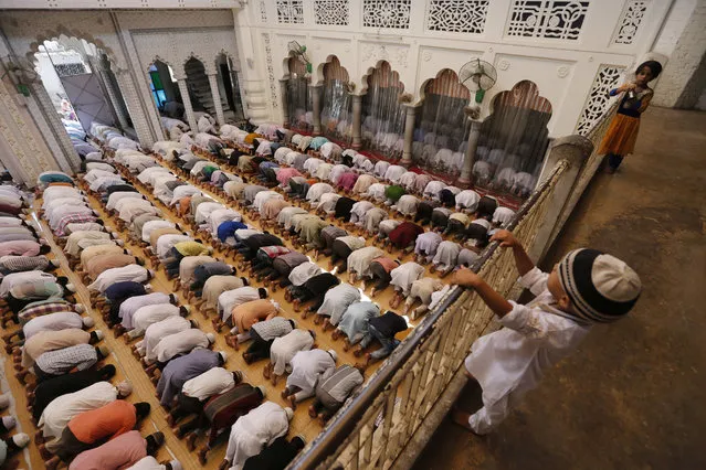 Indian Muslims offer prayers on the first Friday of the holy Islamic month of Ramadan at a mosque in Allahabad, India, Friday, June 2, 2017. Muslims throughout the world are marking the month of Ramadan, the holiest month on the Islamic calendar during which devotees fast from dawn till dusk. (Photo by Rajesh Kumar Singh/AP Photo)