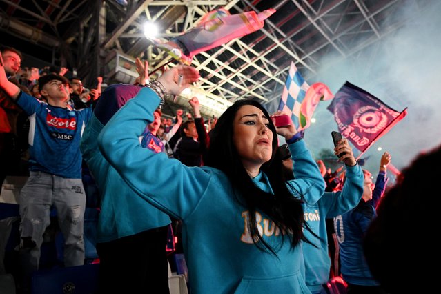 Fans of SSC Napoli celebrate their side's first goal scored by Victor Osimhen of SSC Napoli as they watch the Serie A match between Udinese Calcio and SSC Napoli live on a big screen at Stadio Diego Armando Maradona on May 04, 2023 in Naples, Italy. (Photo by Francesco Pecoraro/Getty Images)