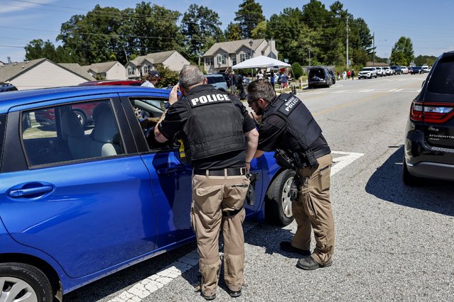 Police officers on the scene of a shooting at Apalachee High School in Winder, Georgia, USA, 04 September 2024. At least four people died and nine injured after a shooting at the school, the Georgia Bureau of Investigation (GBI) announced on social media platform X, formerly Twitter, adding that one suspect was in custody. (Photo by Erik S. Lesser/EPA/EFE)