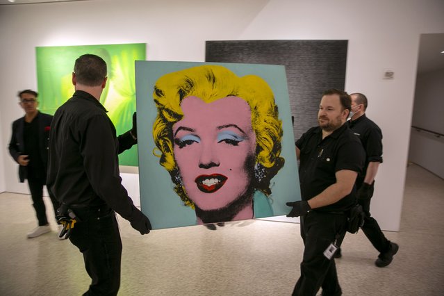The 1964 painting Shot Sage Blue Marilyn by Andy Warhol is visible in Christie's showroom in New York City on Sunday, May 8, 2022. The auction house predicts it will sell for $200 million on Monday, becoming the most expensive 20th-century artwork to sell at auction. (Photo by Ted Shaffrey/AP Photo)