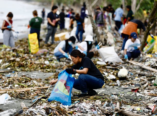 Environmental advocate volunteers collect trash on the eve of International Coastal Cleanup Day in Navotas city, Metro Manila, Philippines, 20 September 2024. International Coastal Cleanup Day is the world's largest volunteer effort for ocean's health that held annually on every third Saturday of September, with this year’s theme “Arctic Cities and Marine Litter”. (Photo by Francis R. Malasig/EPA/EFE/Rex Features/Shutterstock)