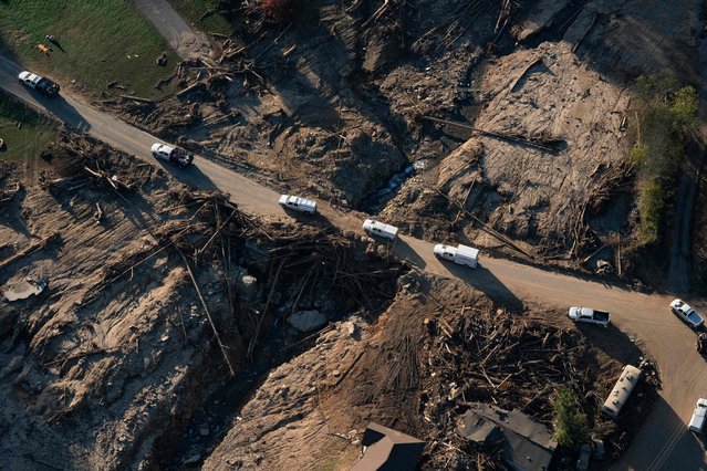 This aerial view shows destruction in Gerton, North Carolina, on October 7, 2024 after the passage of Hurricane Helene. More than 230 people are now confirmed dead after Hurricane Helene carved a path of destruction through several US states, officials said, making it the second deadliest storm to hit the US mainland in more than half a century. (Photo by Allison Joyce/AFP Photo)