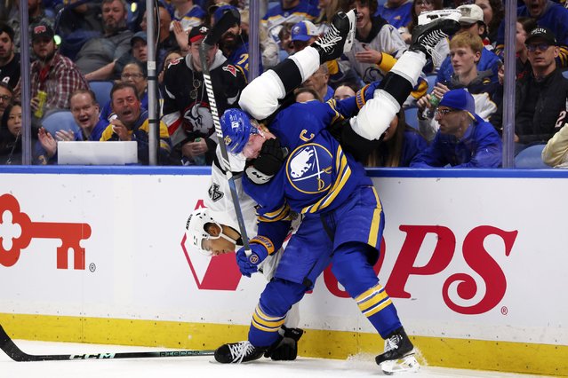 Buffalo Sabres defenseman Rasmus Dahlin (26) checks Los Angeles forward Andre Lee (47) during the second period of an NHL hockey game Thursday, October 10, 2024, in Buffalo, N.Y. (Photo by Jeffrey T. Barnes/AP Photo)