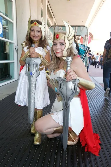 Costumed fans Alexa Kiss and Nicolle Hanbury pose for photos outside the San Diego Convention Center, July 24, 2014, in San Diego. (Photo by Daniel Knighton/Getty Images)