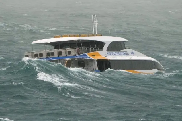 The Manly Ferry makes its way through heavy swells across Sydney Harbour, Australia, Sunday, July 3, 2022. A severe weather warning for heavy rainfall and strong winds has been issued for Sydney, as parts of NSW have received more than their monthly average rainfall within hours this weekend. (Photo by Mark Baker/AP Photo)
