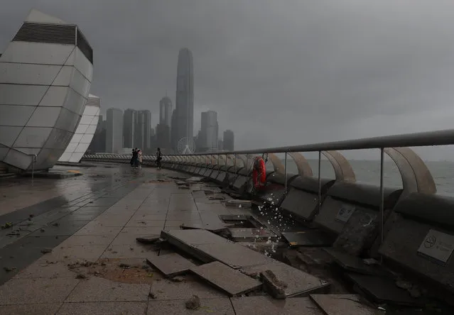 Debris caused by Typhoon Hato damage is strewn across  the waterfront of Victoria Habour in Hong Kong, Wednesday, August 23, 2017. (Photo by Vincent Yu/AP Photo)
