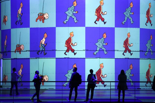 Visitors visit the immersive exhibition “Tintin, The Immersive Adventure” (Tintin, l'Aventure immersive) at the Bassins des Lumières on October 19, 2023 in Bordeaux, France. From the first edition of Tintin in the Land of the Soviets in 1929 to the most recent publications, “Tintin, the Immersive Adventure” pays tribute to the famous reporter, the great traveller whose adventures around the world have been part of popular culture for almost 100 years. (Photo by Moritz Thibaud/ABACA Press/Rex Features/Shutterstock)
