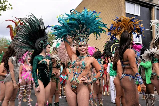 Revellers take part in the Notting Hill Carnival in London, Britain on August 29, 2022. (Photo by Maja Smiejkowska/Reuters)