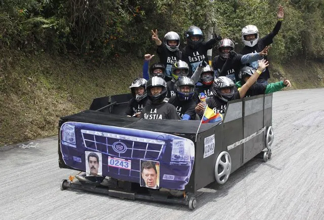 Participants descend a hill on a homemade cart during the 26th Roller Cart Festival in Medellin, Colombia September 6, 2015. (Photo by Fredy Builes/Reuters)