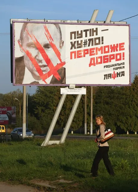 A billboard of the Ukrainian far-right Radical Party vilifies Russian President Vladimir Putin on September 17, 2014 in Lviv, Ukraine. Many Ukrainians blame Putin for stoking the violence between Ukrainian armed forces and pro-Russian separatists in eastern Ukraine in a conflict that is simmering despite recent ceasefire overtures. (Photo by Sean Gallup/Getty Images)
