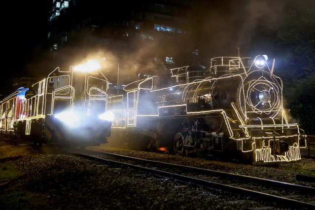 Tourist trains “La Sabana” are decorated with Christmas lights in Bogota, Colombia on December 11, 2023. (Photo by Luisa Gonzalez/Reuters)