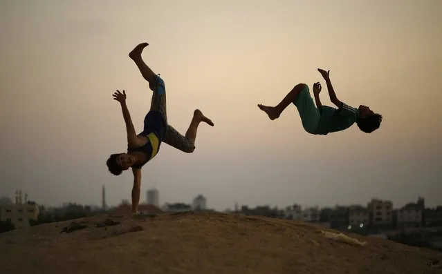 Palestinian youths practise parkour in Gaza City on August 11, 2017. (Photo by Mohammed Abed/AFP Photo)