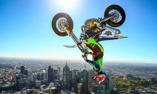 View: gold. Freestyle trials rider Jack Field of Australia performs the highest backflip on a motorcycle ever recorded, above the roof of Melbourne’s Eureka Tower. (Photo by Scott Barbour/Getty Images)