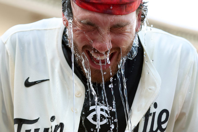 DaShawn Keirsey Jr. #21 of the Minnesota Twins is doused with water after hitting a walk-off single against the San Francisco Giants to end the game at Target Field on May 11, 2025 in Minneapolis, Minnesota. The Twins defeated the Giants 7-6 in ten innings. (Photo by David Berding/Getty Images/AFP Photo)