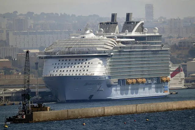 The world's biggest cruise liner the Harmony of the Seas is docked in the French port of Marseille, southern France, on September 13, 2016. One person was killed and two were seriously injured on September 13 when a lifeboat became detached from the Harmony of the Seas, which was docked in the French port of Marseille, emergency services said. The lifeboat “became detached” from the ship with five people on board, the spokesman said, but there was no immediate confirmation of reports that they had been taking part in a safety drill at the time. (Photo by Boris Horvat/AFP Photo)