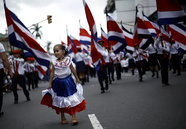 A girl wearing a dress with the colours of Costa Rica's flag takes part in a parade  to commemorate Costa Rica's Independence Day in San Jose, Costa Rica, September 15, 2016. (Photo by Juan Carlos Ulate/Reuters)