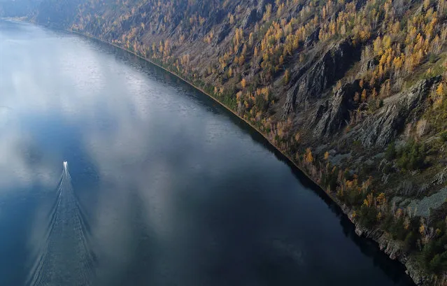A boat is seen on the Yenisei River in the Siberian Taiga area outside Krasnoyarsk, Russia October 5, 2017. (Photo by Ilya Naymushin/Reuters)