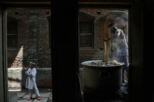 An artisan dyes a Banarasi saree at his workshop in Varanasi on June 28, 2025. (Photo by Niharika Kulkarni/AFP Photo)