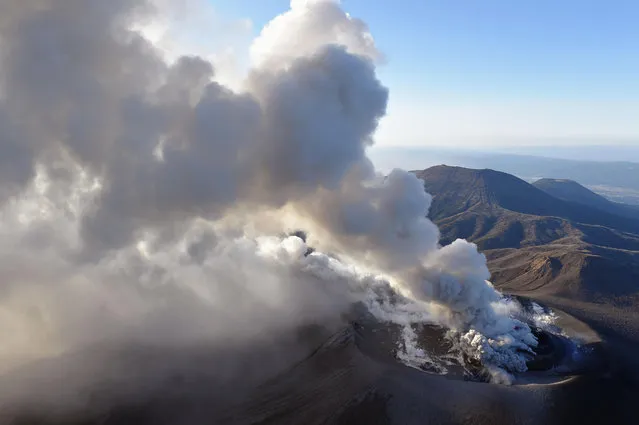 A column of volcanic smoke rises from the crater on the Shinmoedake volcano after its eruption in Kirishima, southern Japan, Tuesday, March 6, 2018. The volcano erupted violently several times Tuesday, shooting up ash and smoke up to 2,300 meters (7,500 feet) in its biggest explosion since 2011, the Meteorological Agency said. (Photo by Kyodo News via AP Photo)