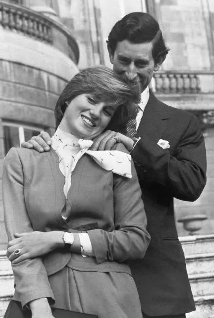 Prince Charles and Lady Diana Spencer (wearing the diamond and sapphire engagement ring he gave her) looking affectionate in the grounds of Buckingham Palace after the announcement of their engagement in London on February 24, 1981. (Photo by Ron Bell/AP Photo/Pool)