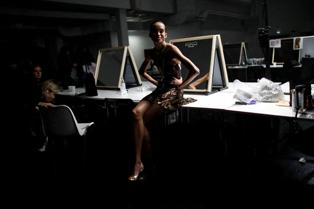 A model prepares backstage of the Roberto Cavalli Spring/Summer 2026 collection show during Milan Fashion Week, in Milan, Italy, on September 25, 2025. (Photo by Alessandro Garofalo/Reuters)