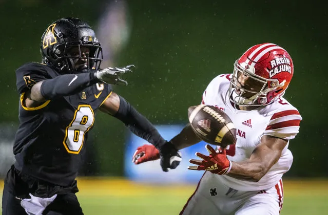 Louisiana-Lafayette wide receiver Kyren Lacy (2) misses a reception under coverage from Appalachian State defensive back Shemar Jean-Charles (8) during an NCAA college football game Friday, December 4, 2020, in Boone, N.C. (Photo by Andrew Dye/The Winston-Salem Journal via AP Photo/Pool)