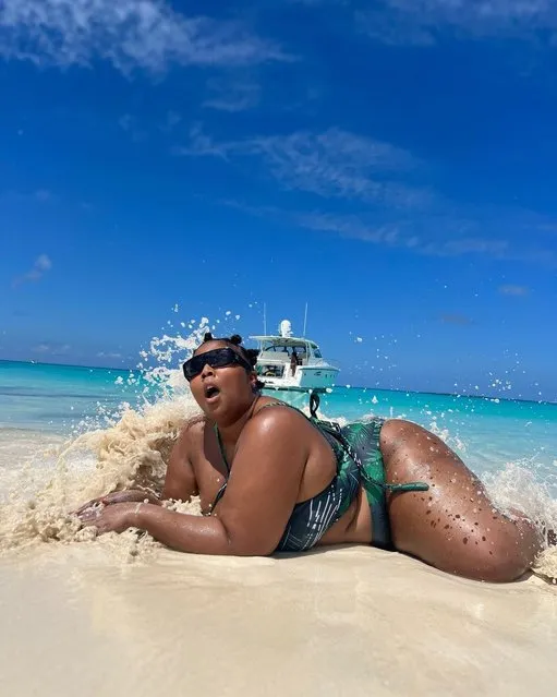 American rapper Melissa Viviane Jefferson, known professionally as Lizzo flails around on the beach in the last decade of March 2023. (Photo by lizzobeeating/Instagram)