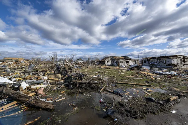 Damage from a late-night tornado is seen in Sullivan, Ind., Saturday, April 1, 2023. Multiple deaths were reported in the area following the storm. (Photo by Doug McSchooler/AP Photo)