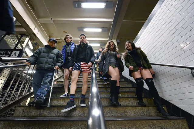 Participants in underwear walk through the Times Square subway station during the 14th Annual “No Pants Subway Ride”  in New York, NY, on January 11, 2014. The event is organized by New York City prank collective Improv Everywhere. (Photo by Anthony Behar/SIPA Press)