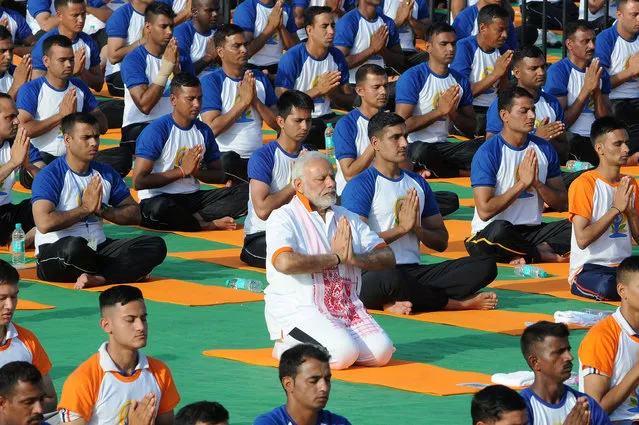 Indian Prime Minister Narendra Modi performs yoga on International Yoga Day in Dehradun in the northern Himalayan state of Uttarakhand, India on June 21, 2018. (Photo by Reuters/Stringer)