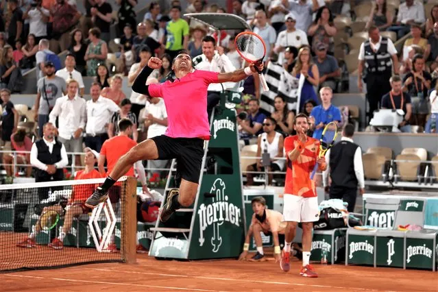 Ivan Dodig of Croatia celebrates winning match point in front of partner Austin Krajicek of United States against Sander Gille of Belgium and Joran Vliegen of Belgium during the Men's Doubles Final match on Day Fourteen of the 2023 French Open at Roland Garros on June 10, 2023 in Paris, France. (Photo by Clive Brunskill/Getty Images)