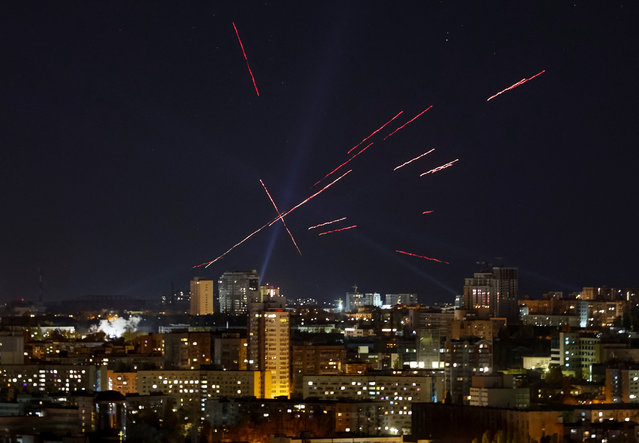 Tracers and searchlights are seen in the night sky as Ukrainian servicemen search and fire at a drone during a Russian drone strike, amid Russia's attack on Ukraine, in Kyiv, Ukraine on November 3, 2024. (Photo by Gleb Garanich/Reuters)