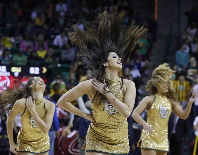Baylor Songleaders dance during a timeout in an NCAA college basketball game against Oklahoma, Saturday, January 24, 2015, in Waco, Texas. Baylor won 69-58. (Photo by Jerry Larson/AP Photo)