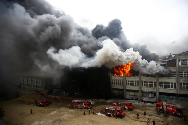 Firemen try to extinguish a fire at a plastic factory in Istanbul, Turkey, November 22, 2016. (Photo by Osman Orsal/Reuters)
