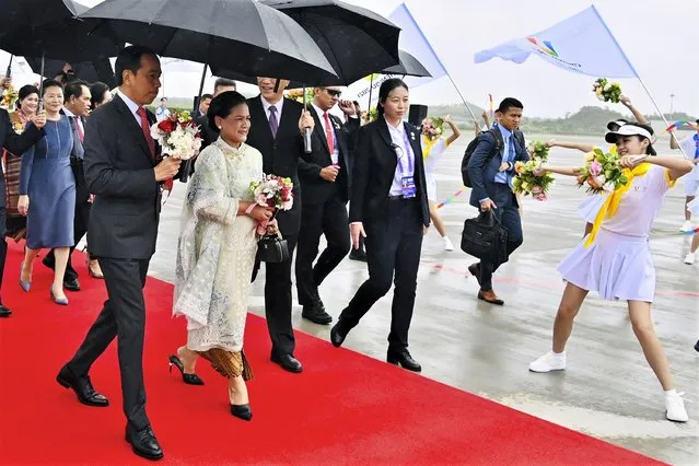 In this photo released by the Press and Media Bureau of the Indonesian Presidential Palace, Indonesian President Joko Widodo, left, and his wife Iriana, second left, are greeted by dancers upon arrival at Chengdu Tianfu International Airport in Chengdu, China, Thursday, July 27, 2023. Indonesian President Joko Widodo arrived Thursday in China and planned to meet with Chinese leader Xi Jinping, a state news agency reported. (Photo by Laily Rachev/Indonesian Presidential Palace via AP Photo)