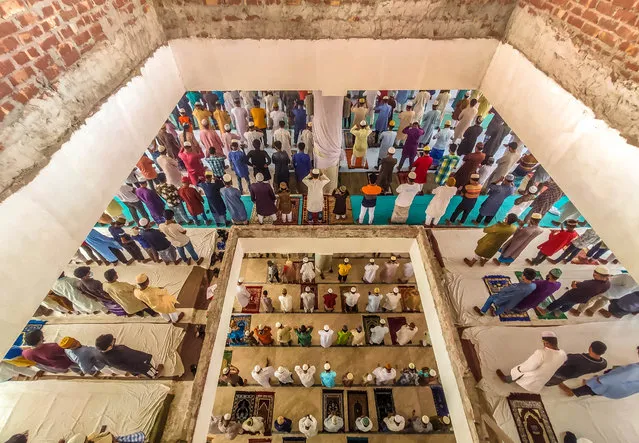 Despite having a lockdown situation in Bangladesh due to an increase in the amount of Covid-19 patients and deaths everyday, people don't maintain a minimum social distance to pray their Muslim Jummah Prayer in a mosque at Barishal City on April 9, 2021. (Photo by Mustasinur Rahman Alvi/ZUMA Wire/Rex Features/Shutterstock)